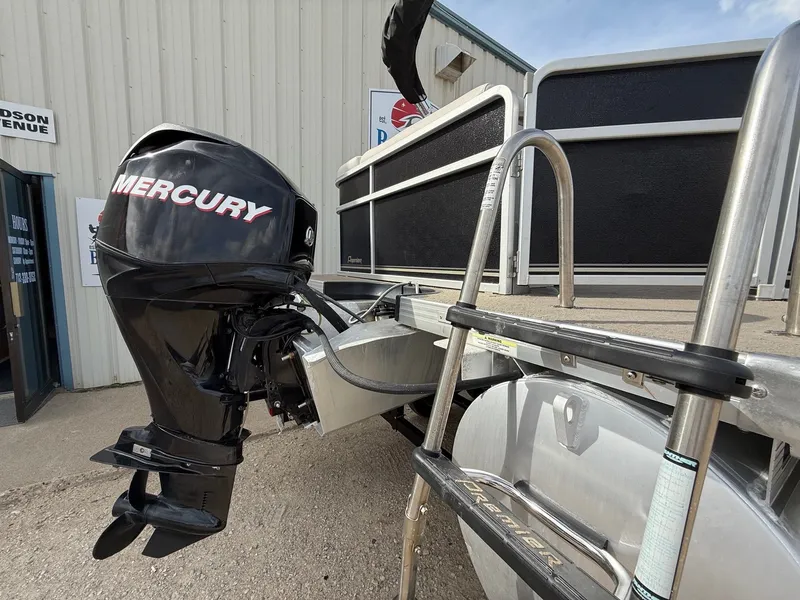 Slide: The Image of 2012 Premier 180 SunSation boat with Mercury outboard motor and boarding ladder. - 20