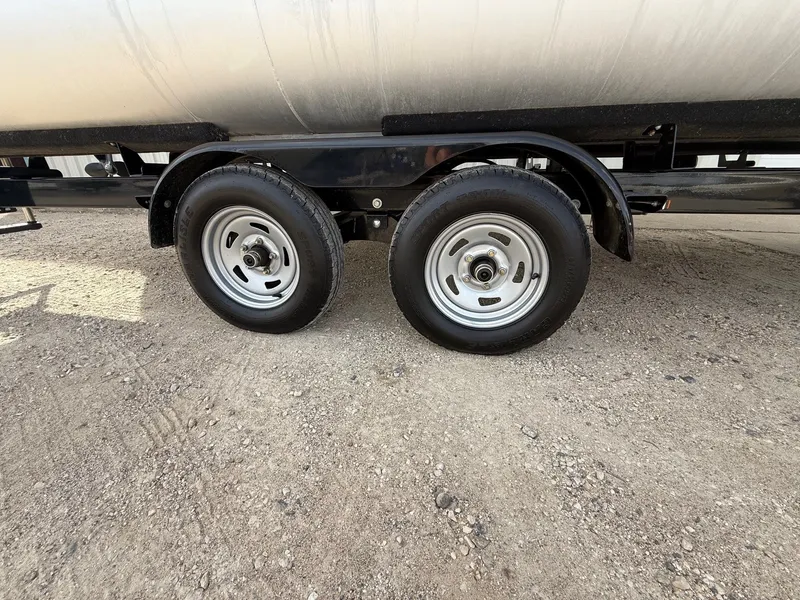 Slide: The Image of Trailer wheels of a 2012 Premier 180 SunSation on gravel surface. - 21