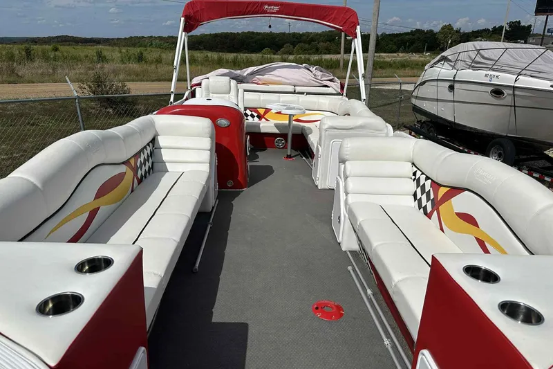 Slide: The Image of 2017 PlayCraft 2700 Extreme pontoon boat with spacious seating and vibrant red accents. - 10