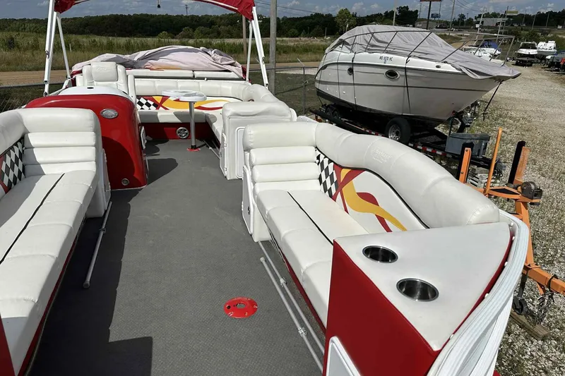Slide: The Image of 2017 PlayCraft 2700 Extreme pontoon boat with spacious seating and vibrant red accents. - 11