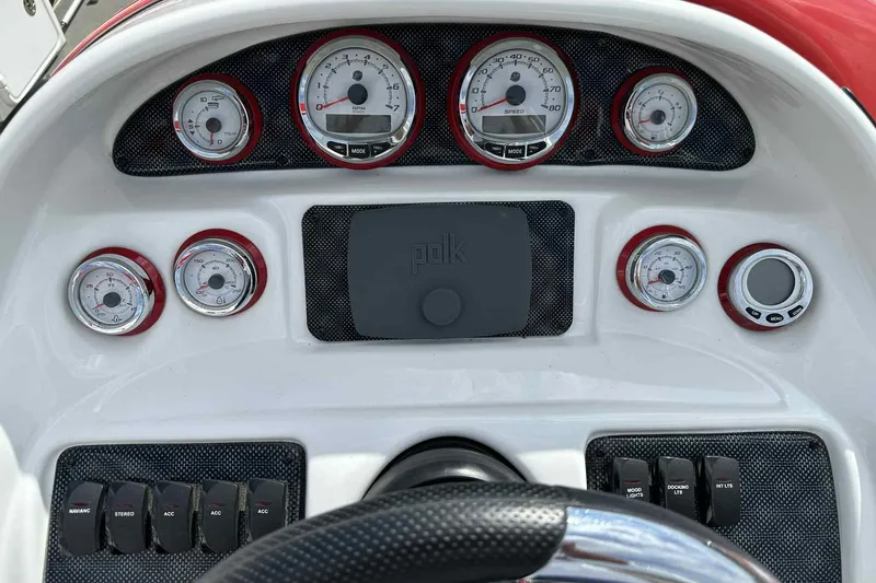 Slide: The Image of Dashboard of 2017 PlayCraft 2700 Extreme boat with gauges and controls. - 19