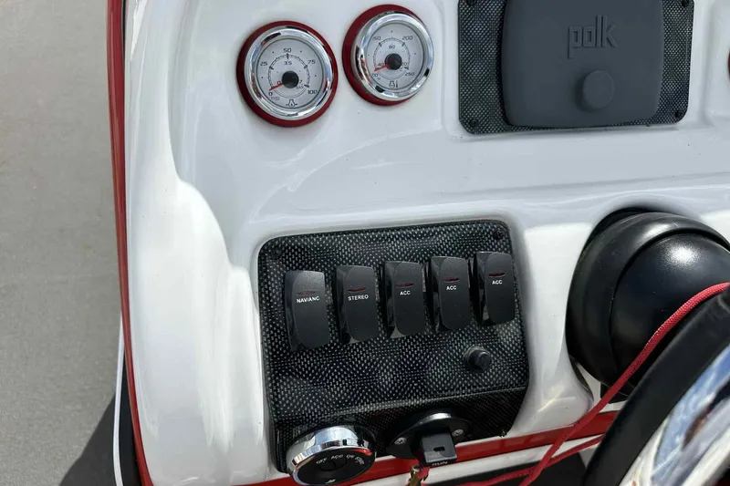 Slide: The Image of Dashboard of 2017 PlayCraft 2700 Extreme boat with gauges and switches. - 20