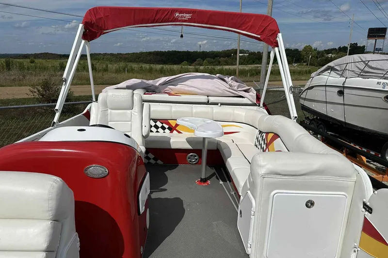 Slide: The Image of 2017 PlayCraft 2700 Extreme pontoon boat with red and white seating and canopy. - 22