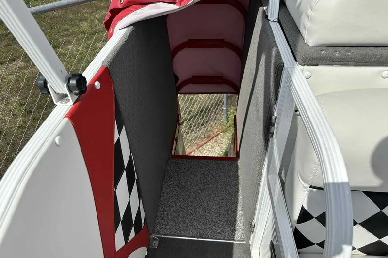 Slide: The Image of Interior view of 2017 PlayCraft 2700 Extreme boat with checkered design accents. - 24