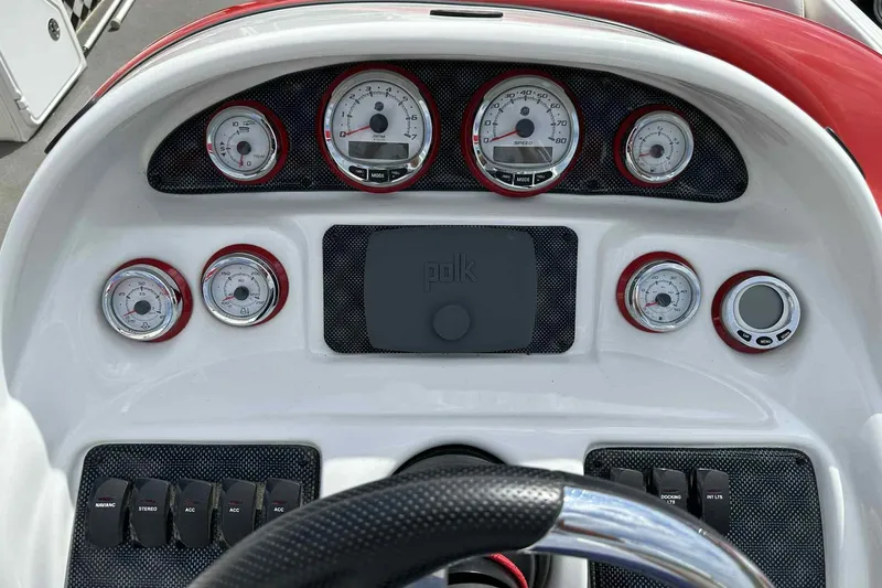 Slide: The Image of Dashboard of 2017 PlayCraft 2700 Extreme boat with gauges and controls. - 26