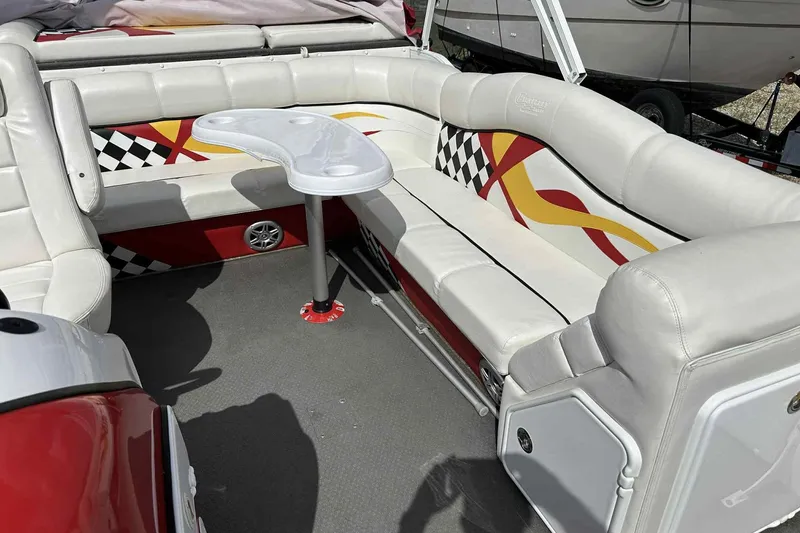 Slide: The Image of 2017 PlayCraft 2700 Extreme boat interior with white seating and colorful design accents. - 27