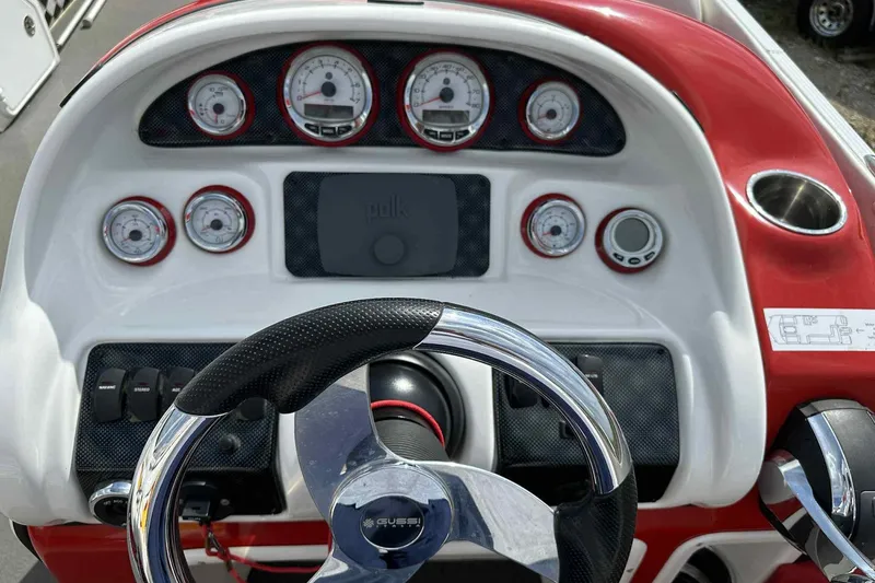 Slide: The Image of Steering console of 2017 PlayCraft 2700 Extreme boat with gauges and controls. - 3