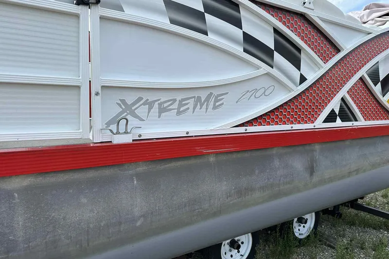 Slide: The Image of 2017 PlayCraft 2700 Extreme boat with checkered and red honeycomb design. - 33
