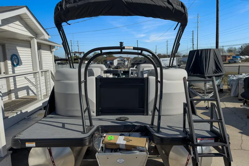 Slide: The Image of 2026 Godfrey Sweetwater 22' Split Bench Tritoon, rear view with ladder and seating. - 21