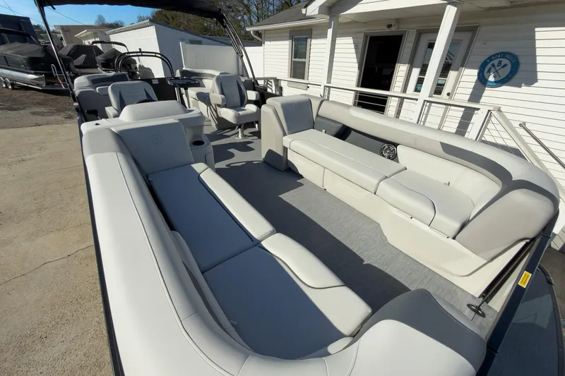 Slide: The Image of 2026 Godfrey Sweetwater 22' Split Bench Tritoon with spacious seating and modern design. - 26