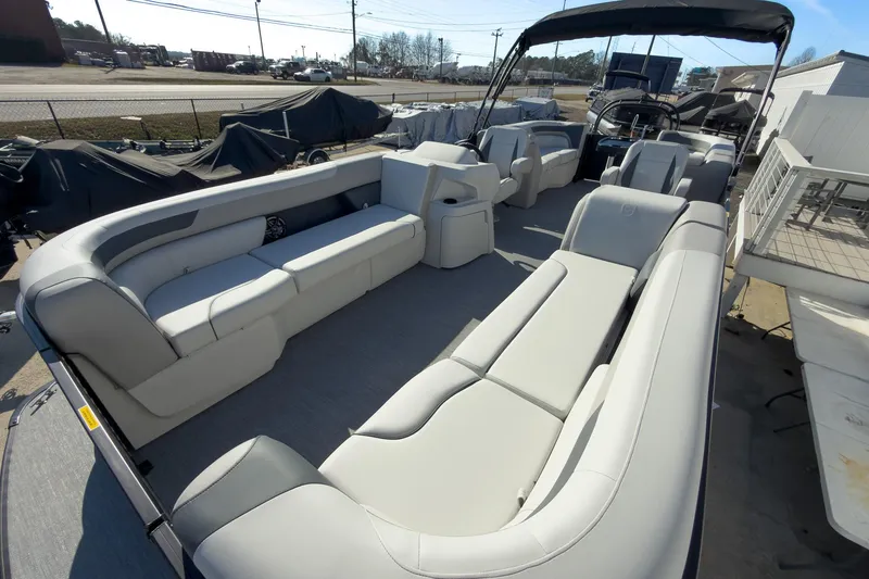Slide: The Image of 2026 Godfrey Sweetwater 22' Split Bench Tritoon with spacious seating and modern design. - 27