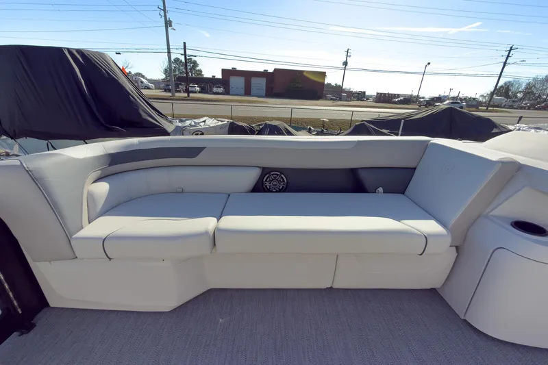 Slide: The Image of 2026 Godfrey Sweetwater 22' Tritoon interior with plush seating and modern design. - 29