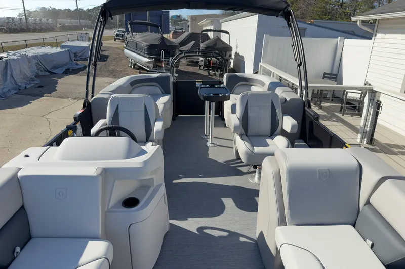 Slide: The Image of 2026 Godfrey Sweetwater 22' Split Bench Tritoon with spacious seating and modern design. - 33