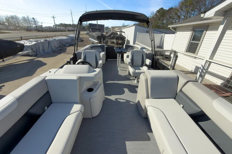 Slide: The Image of 2026 Godfrey Sweetwater 22' Split Bench Tritoon with spacious seating and modern design. - 34