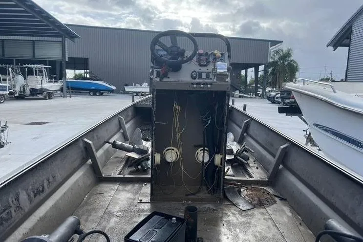 Slide: The Image of Interior view of a 2016 Pro-Drive X Series 20' boat with exposed wiring. - 6