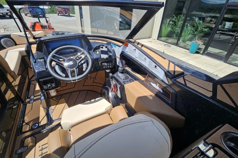 Slide: The Image of Interior of 2025 Varatti Z2474 boat with modern steering and dashboard controls. - 10