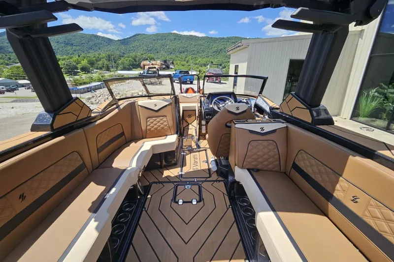 Slide: The Image of Luxurious interior of 2025 Varatti Z2474 boat with tan leather seating and scenic mountain view. - 11