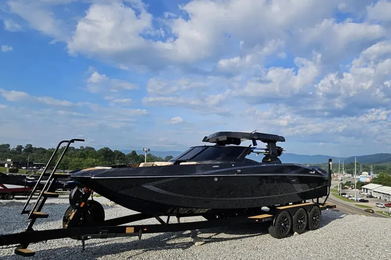 Slide: The Image of 2025 Varatti Z2474 boat on trailer under blue sky with clouds. - 12