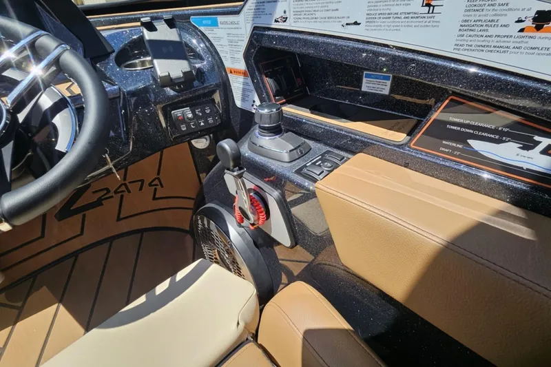 Slide: The Image of Interior of 2025 Varatti Z2474 boat with steering wheel and control panel. - 13