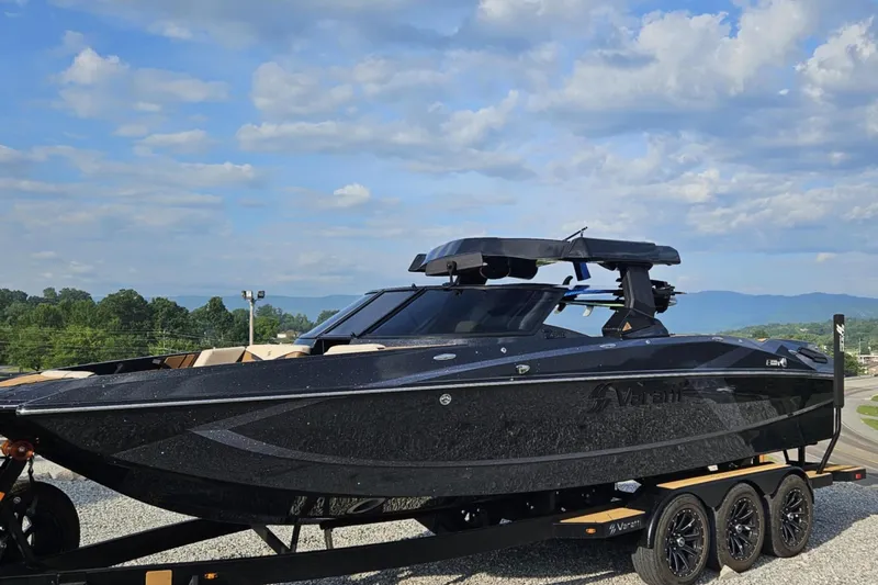 Slide: The Image of 2025 Varatti Z2474 boat on trailer under blue sky, showcasing sleek design and modern features. - 6