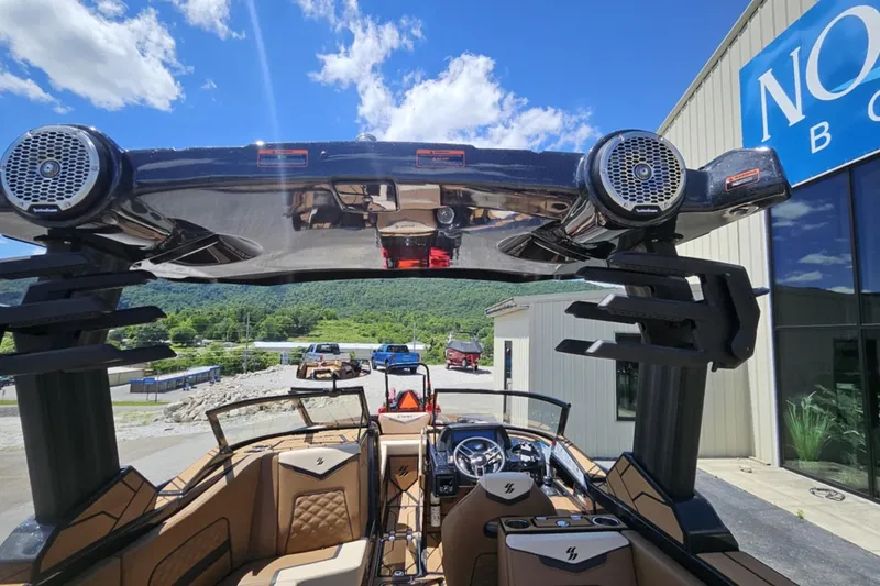 Slide: The Image of 2025 Varatti Z2474 boat with sleek interior and advanced audio system, parked outdoors. - 7