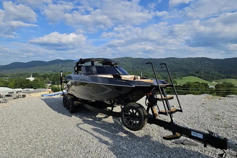 Slide: The Image of 2025 Varatti Z2474 boat on trailer, scenic mountain backdrop, clear sky. - 9