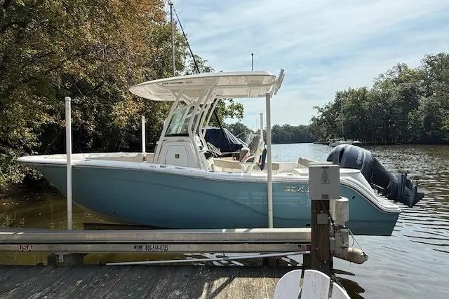 The Image of 2024 Sea Fox 228 Commander boat in light blue, displayed on stands outdoors. - 0