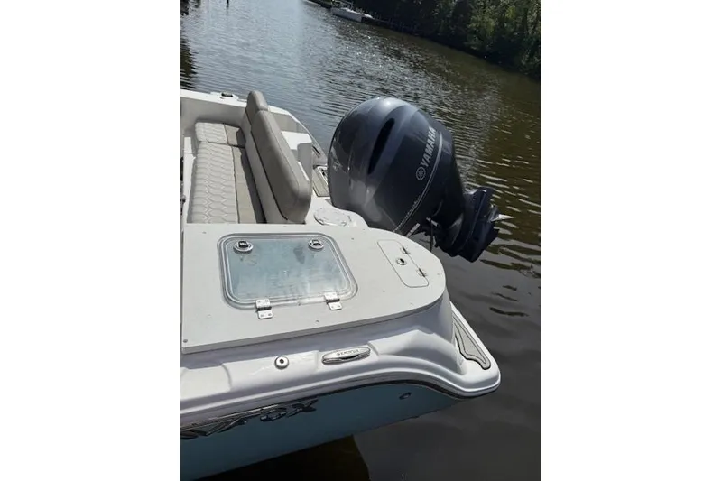 Slide: The Image of 2024 Sea Fox 228 Commander boat interior with seating and engine view. - 21