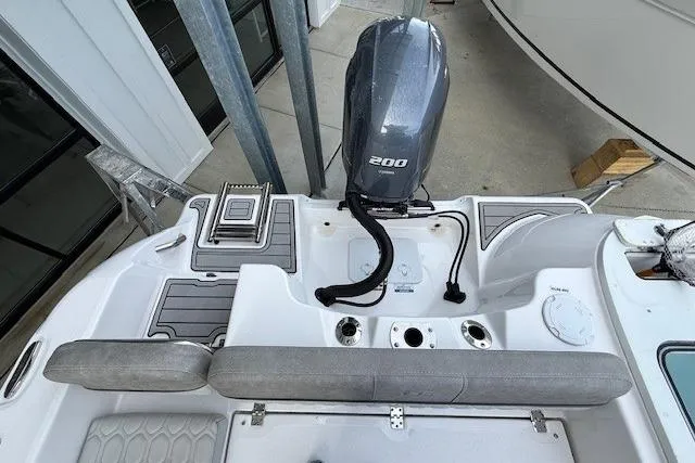 Slide: The Image of 2024 Sea Fox 228 Commander boat with powerful 200 HP engine, rear seating, and sleek design. - 27