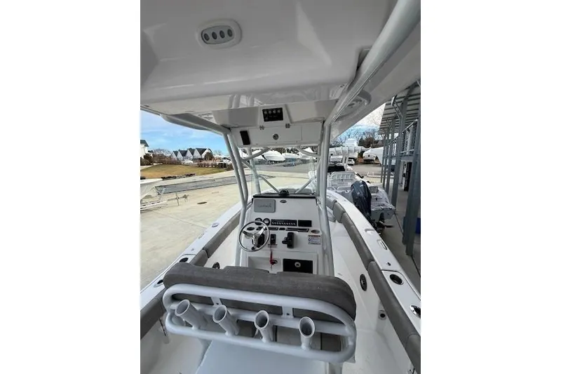 Slide: The Image of 2024 Sea Fox 228 Commander boat interior with helm and seating area. - 29