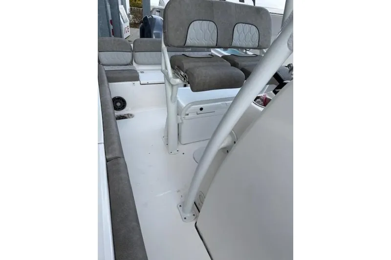 Slide: The Image of 2024 Sea Fox 228 Commander boat interior with cushioned seating and console. - 33