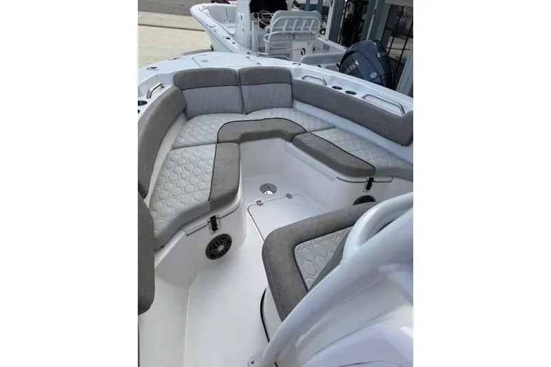 Slide: The Image of 2024 Sea Fox 228 Commander boat interior with cushioned seating and modern design. - 34