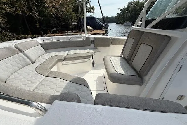 Slide: The Image of 2024 Sea Fox 228 Commander boat with Yamaha outboard motor in a marina setting. - 4