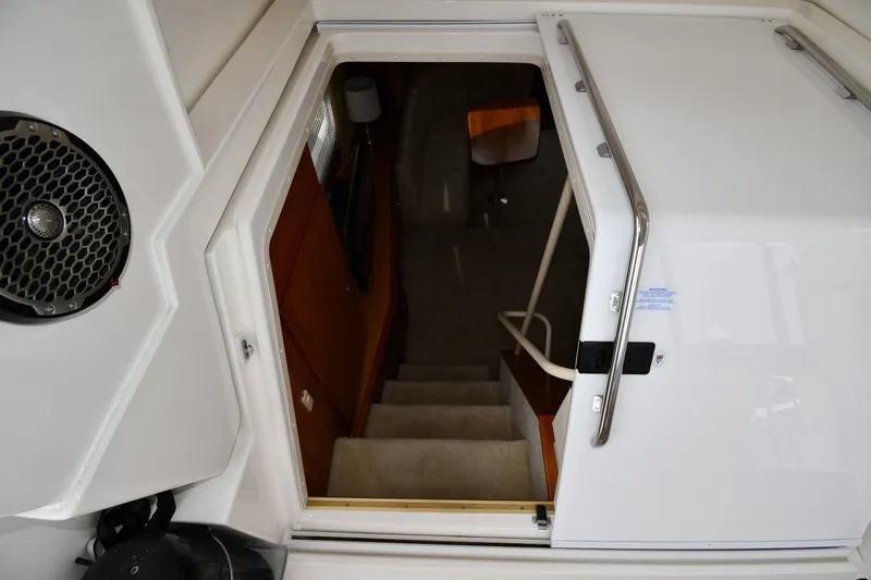 Slide: The Image of Interior view of 2000 Silverton 392 Motor Yacht showing stairs and cabin entrance. - 26