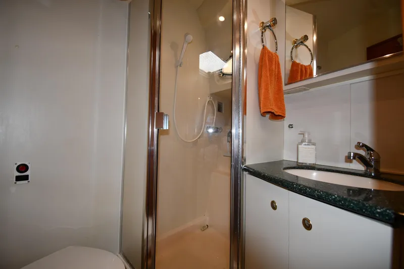 Slide: The Image of Bathroom interior of 2000 Silverton 392 Motor Yacht with shower and sink. - 34