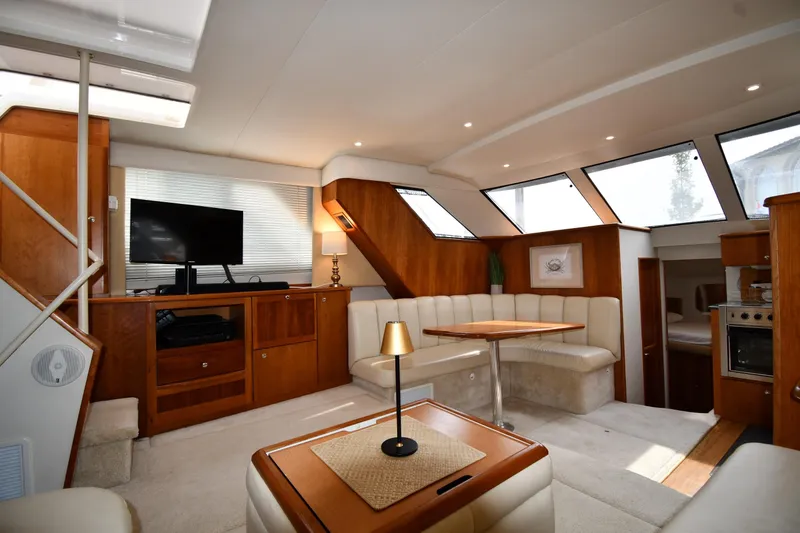 Slide: The Image of Luxurious interior of 2000 Silverton 392 Motor Yacht with elegant seating and modern amenities. - 37