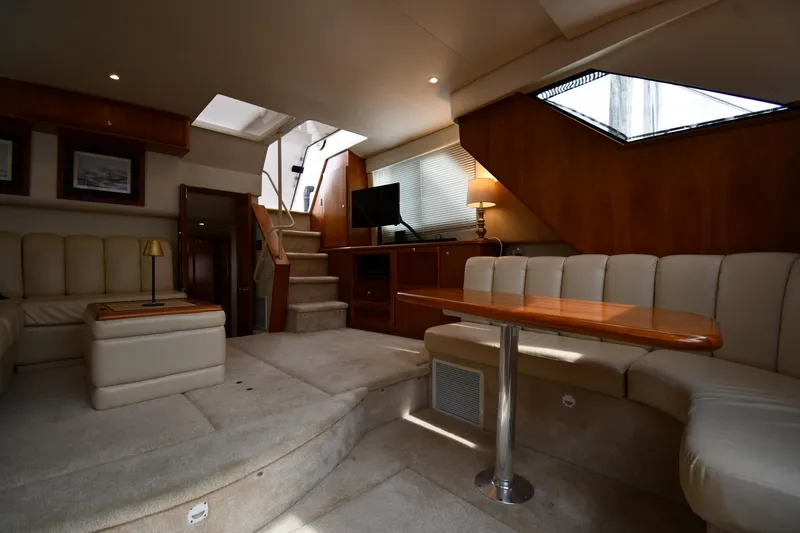 Slide: The Image of Luxurious interior of 2000 Silverton 392 Motor Yacht with plush seating and elegant decor. - 38