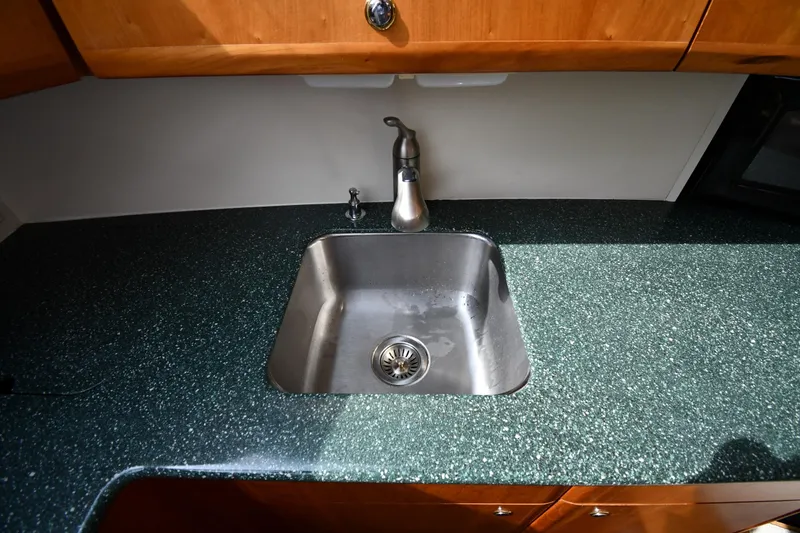 Slide: The Image of Stainless steel sink in 2000 Silverton 392 Motor Yacht kitchen area. - 41