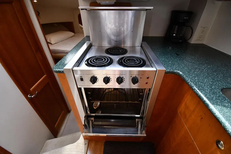 Slide: The Image of Galley kitchen in 2000 Silverton 392 Motor Yacht with stove and oven. - 44