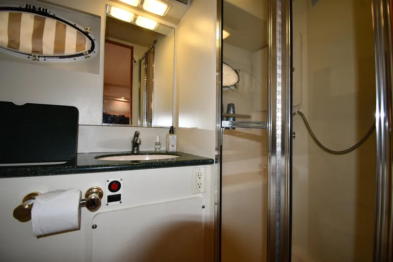 Slide: The Image of Bathroom interior of 2000 Silverton 392 Motor Yacht with shower and sink. - 53