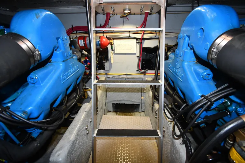 Slide: The Image of Engine room of 2000 Silverton 392 Motor Yacht with blue Crusader engines. - 57
