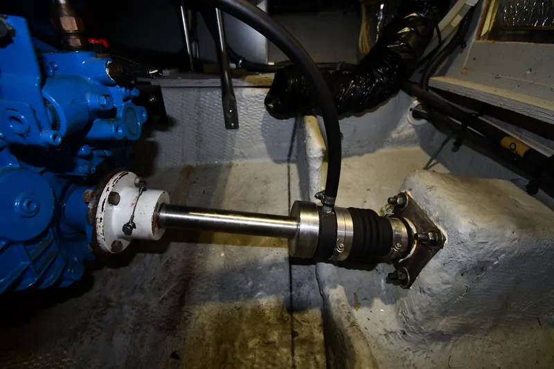 Slide: The Image of Engine compartment of a 2000 Silverton 392 Motor Yacht, featuring mechanical components. - 59