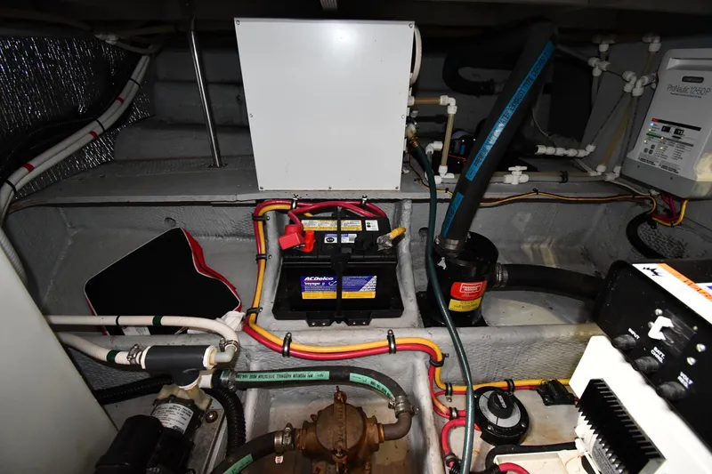 Slide: The Image of Engine room of a 2000 Silverton 392 Motor Yacht with battery and wiring. - 62