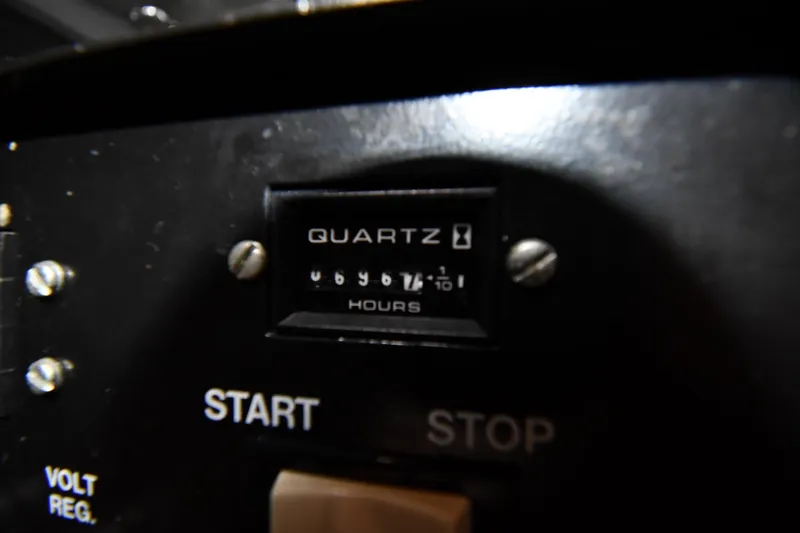 Slide: The Image of Hour meter on 2000 Silverton 392 Motor Yacht dashboard, showing engine hours. - 64