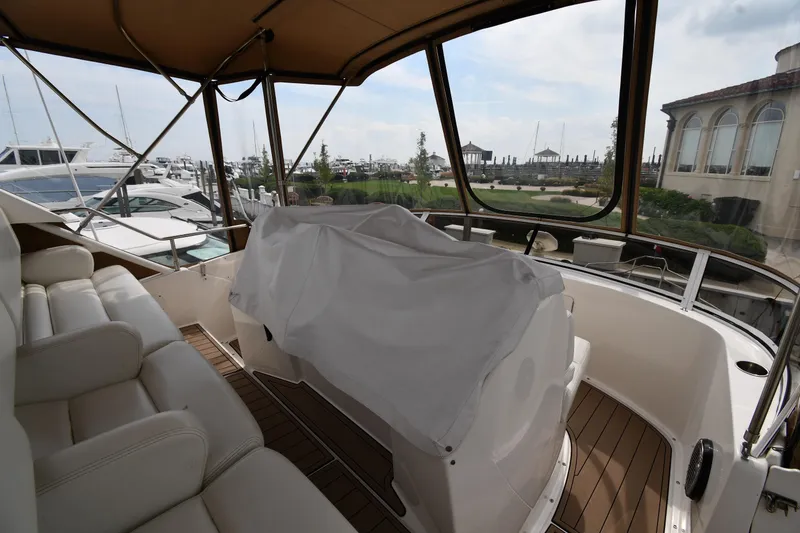 Slide: The Image of Interior view of 2000 Silverton 392 Motor Yacht with covered helm and seating. - 7