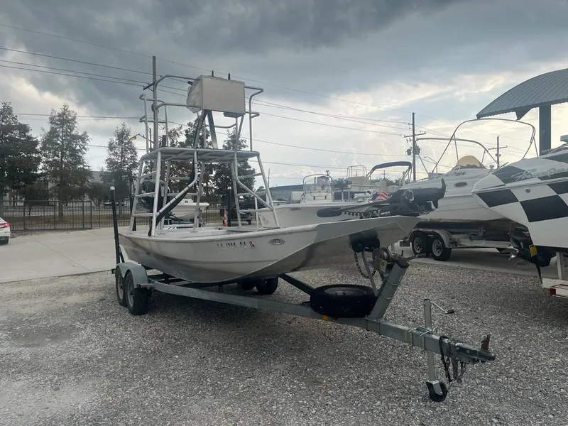Slide: The Image of 2012 Sportsman Custom Build boat on trailer under cloudy sky. - 3