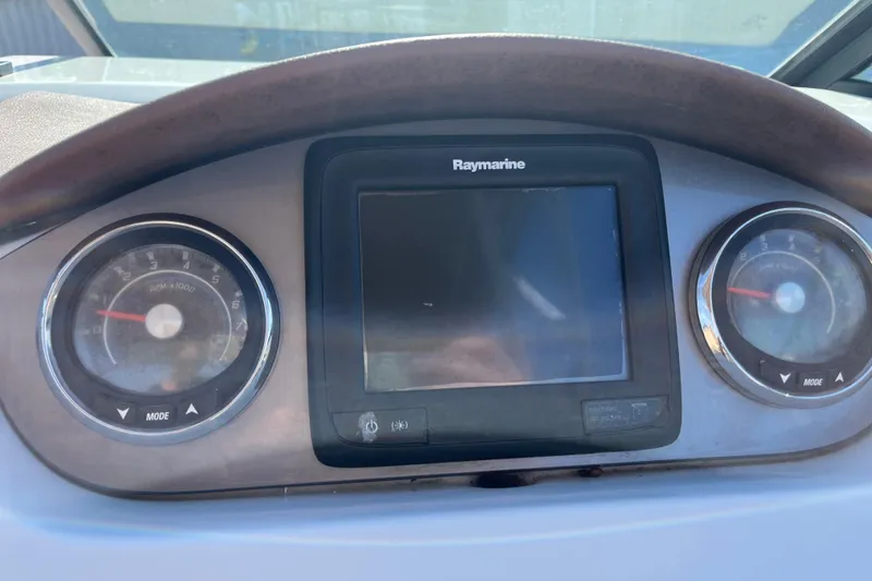 Slide: The Image of Dashboard of 2017 Sea Ray SDX 290 Outboard with Raymarine display and gauges. - 16