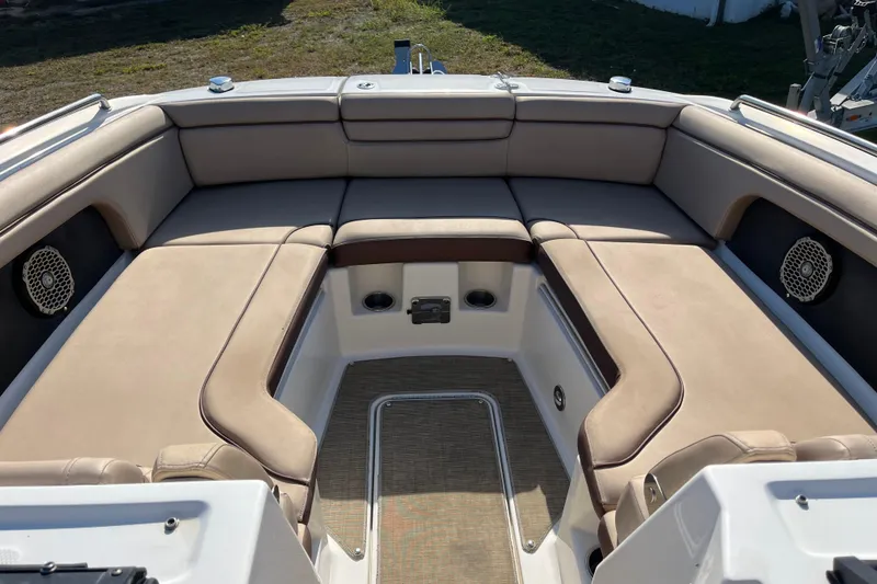 Slide: The Image of 2017 Sea Ray SDX 290 Outboard boat interior with beige seating and speakers. - 19
