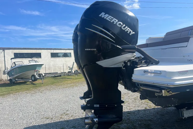 Slide: The Image of 2017 Sea Ray SDX 290 Outboard with Mercury Verado engine in a boatyard setting. - 24