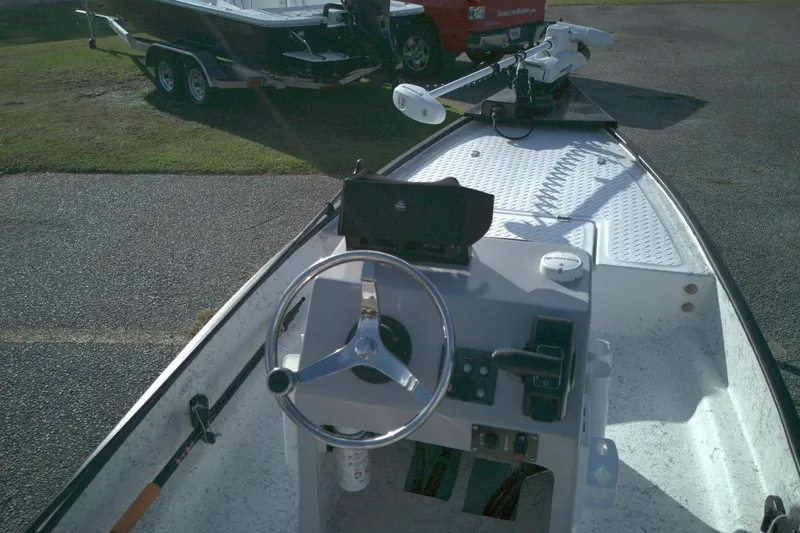 Slide: The Image of 2023 Santee 16CC boat interior with steering wheel and control panel. - 3